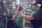 Image: Examining a snake at the campsite