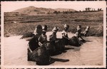 Front: Malagasy women fishing with baskets