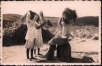 Front: Threshing rice in Madagascar