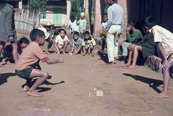 Young boys playing flick football: Friends School, Soavinandriana