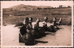 Malagasy women fishing with baskets